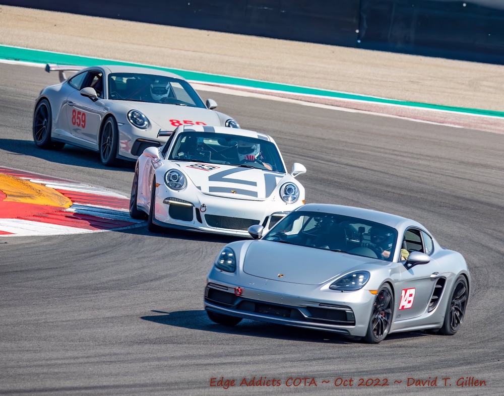 Three Porsche race cars at Circuit of the Americas